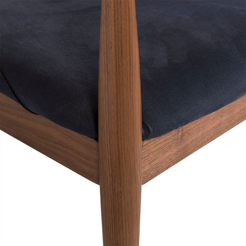 Mid-century modern walnut armchair with a curved backrest and a dark upholstered seat cushion, suitable for stylish dining rooms, Detail view 2.