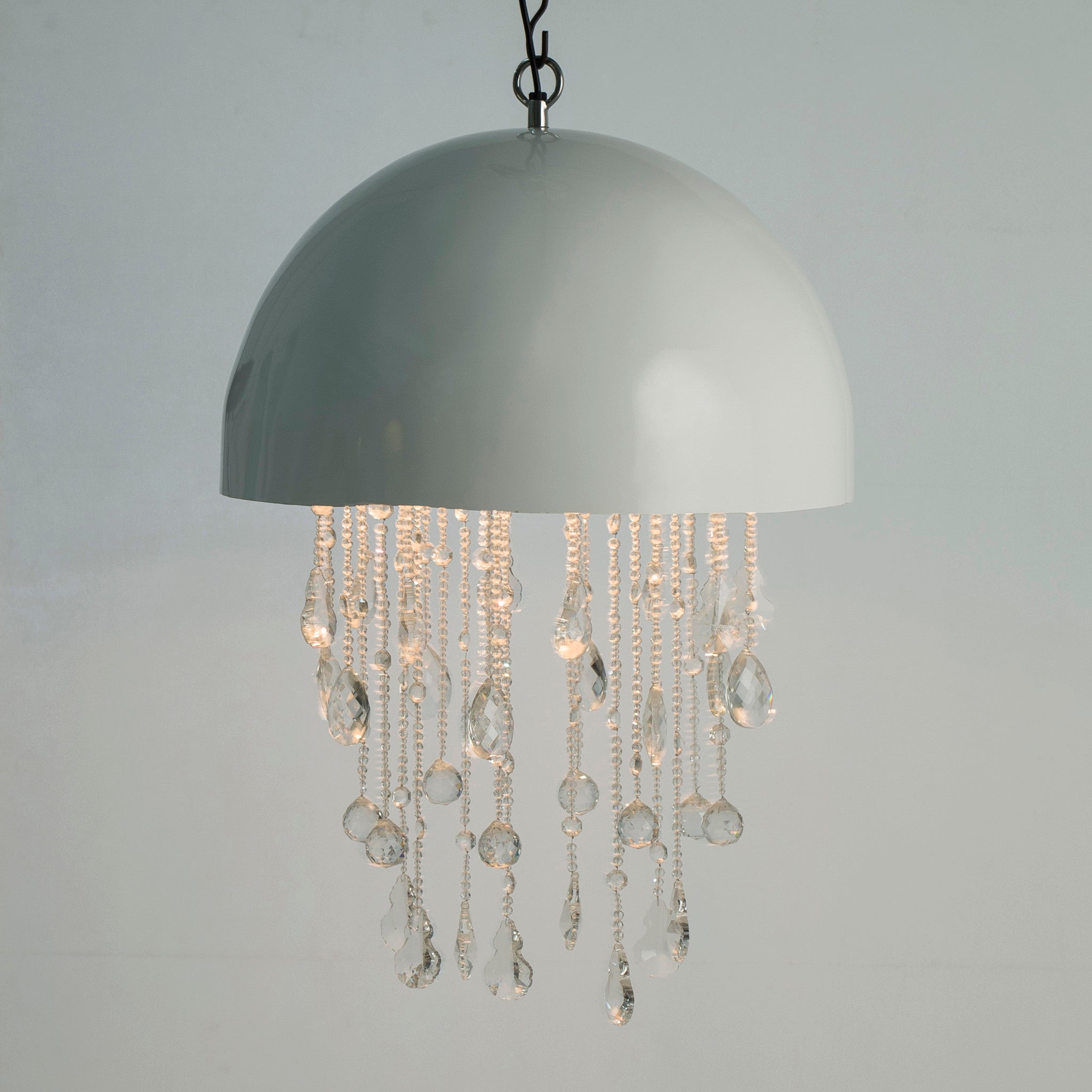 Modern pendant light with a glossy white dome shade and cascading crystal droplets, offering an elegant and contemporary lighting solution, Side View.